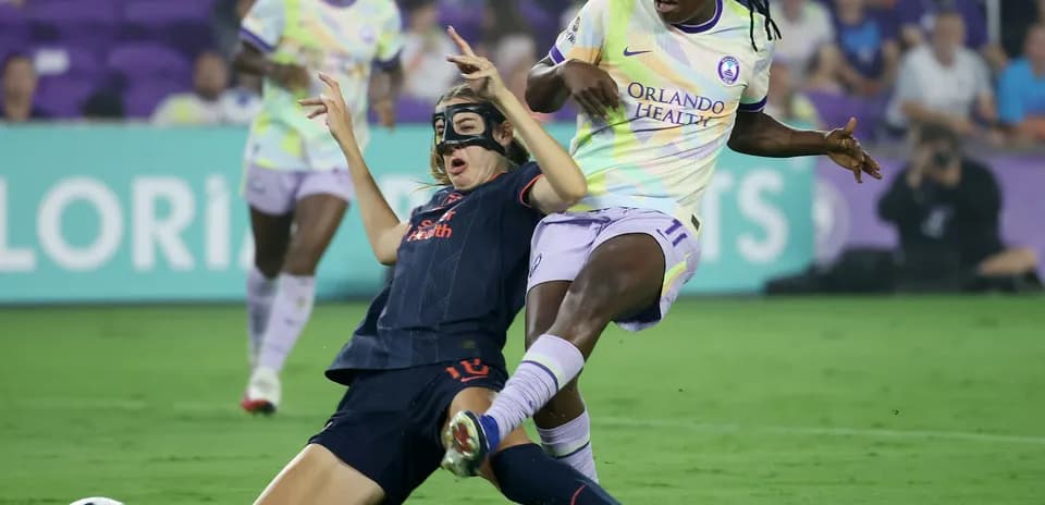 Bay FC W player tackling Orlando Pride W opponent