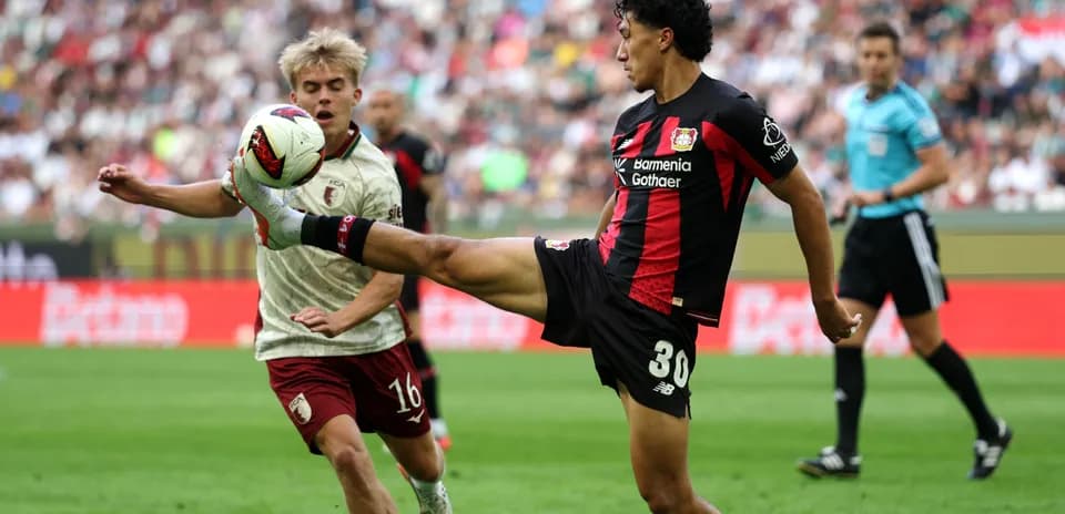 Player kicking the ball during a match action
