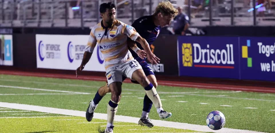 Player tackling opponent during One Knoxville match