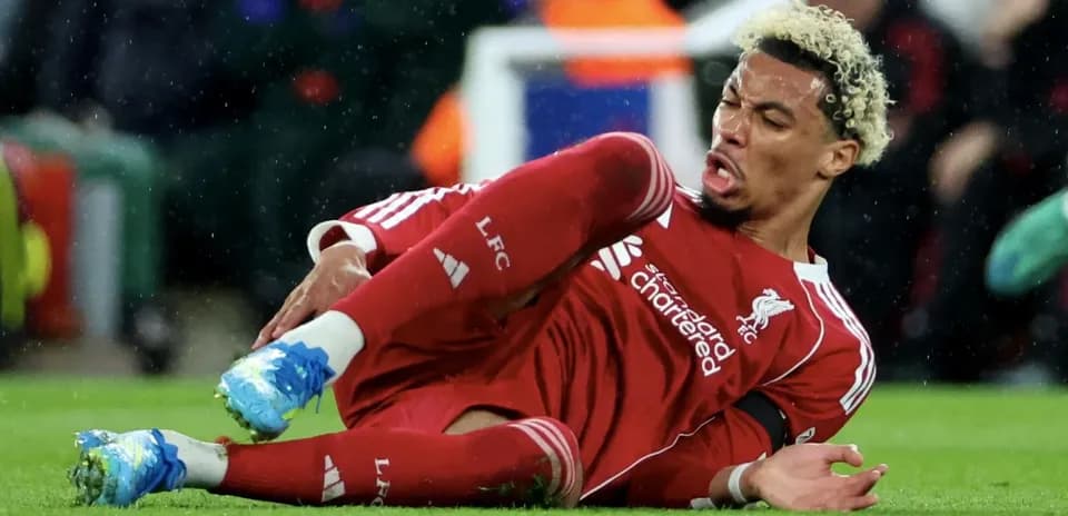Liverpool player on the ground after falling during match