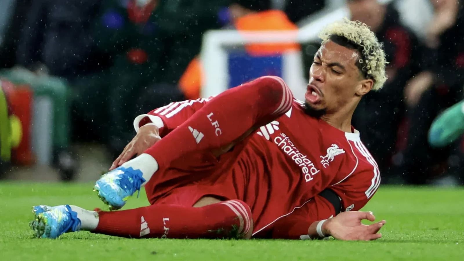 Liverpool player on the ground after falling during match