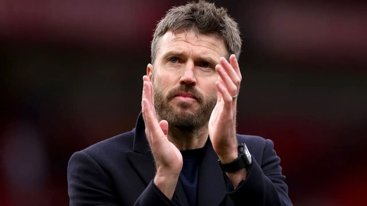Man applauding on the sidelines during a match