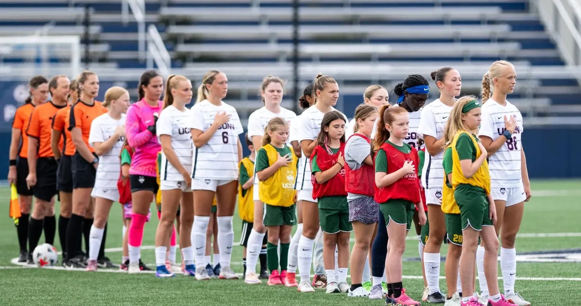 Players and officials lined up for national anthem