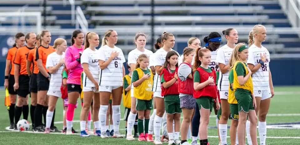 Players and officials lined up for national anthem