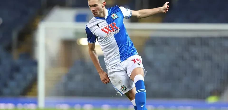 Player kicking the ball during a football match