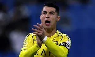 Player in yellow jersey clapping during match