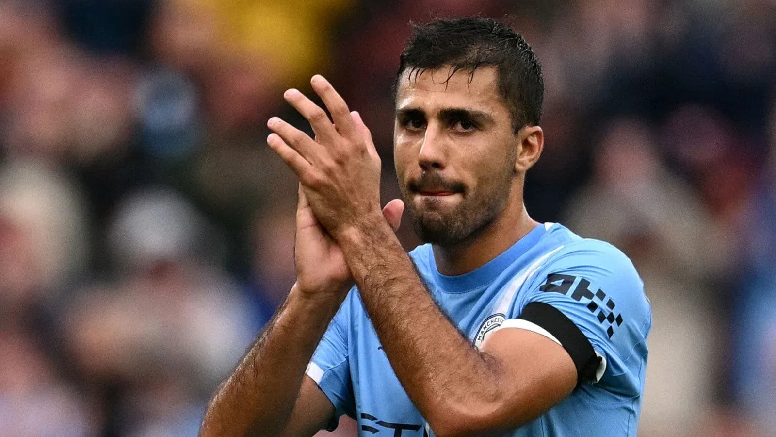 Player applauding fans after the match