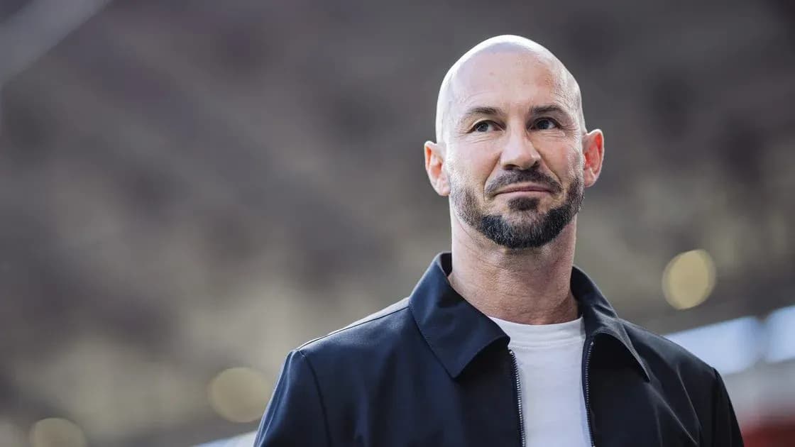 Man in black jacket with beard at event
