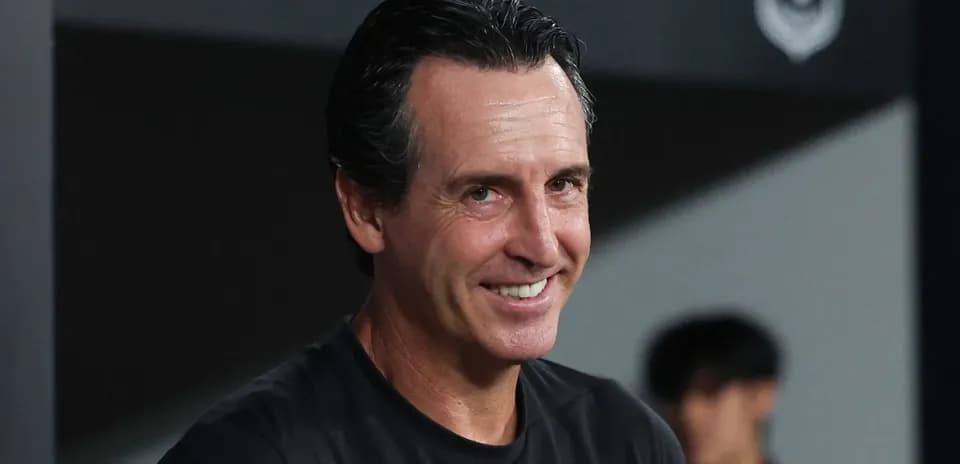Coach smiling during match day preparations