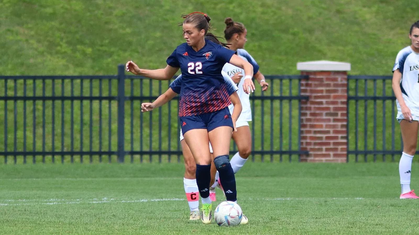 Player dribbling the ball during soccer match