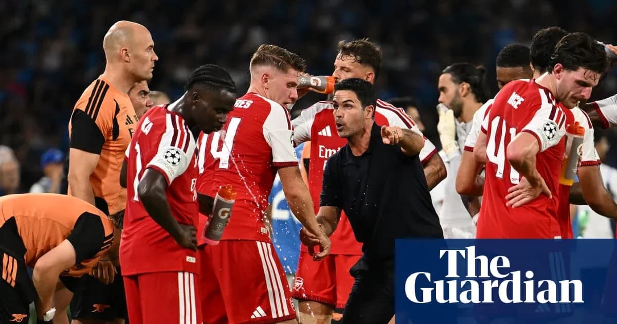 Arsenal players receiving instructions during match break