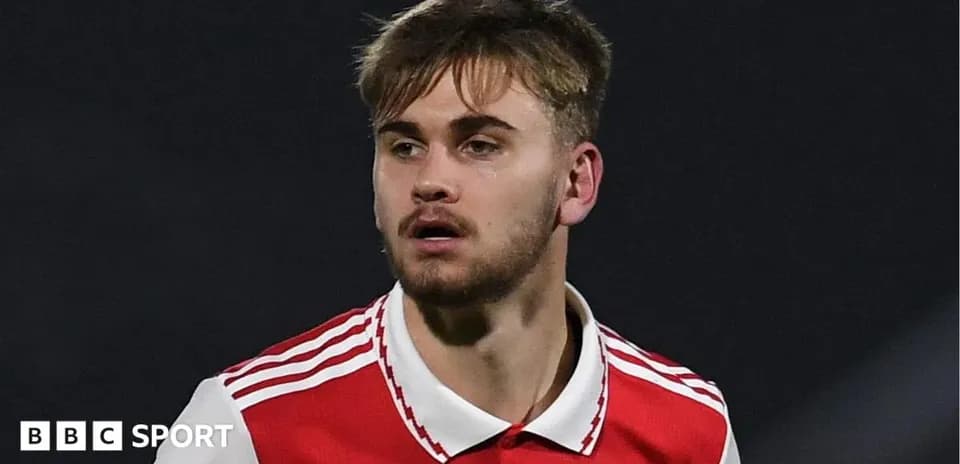 Player in red jersey during match action