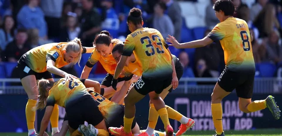 Players celebrating a goal during match