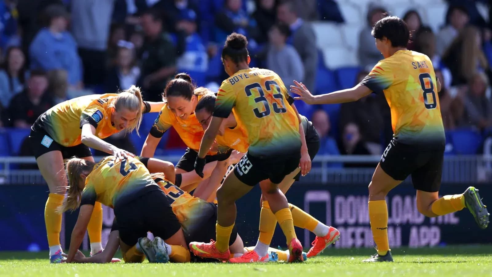 Players celebrating a goal during match