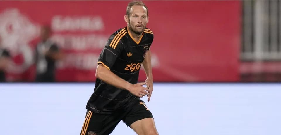 Player in Ajax kit running on the field