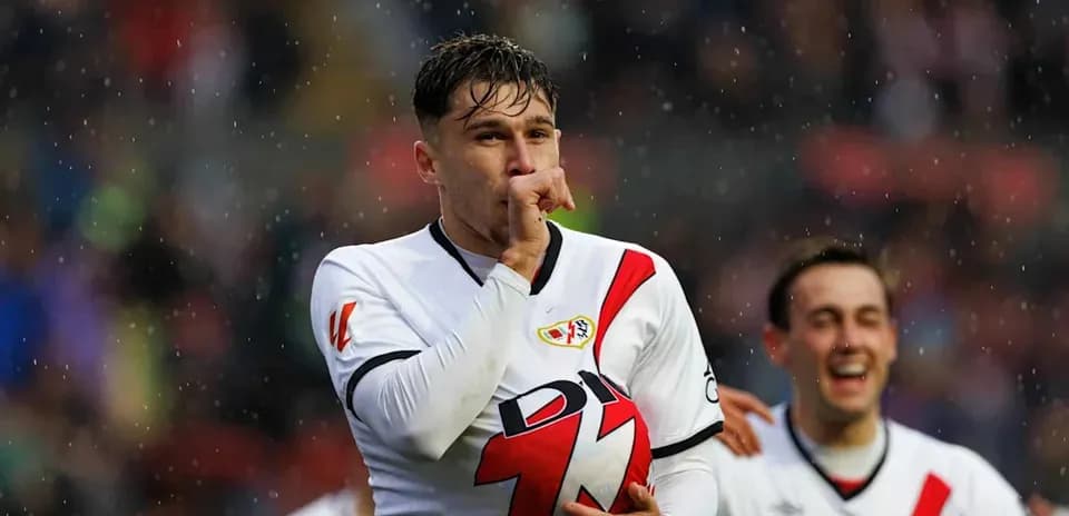 Player celebrating with ball after scoring goal