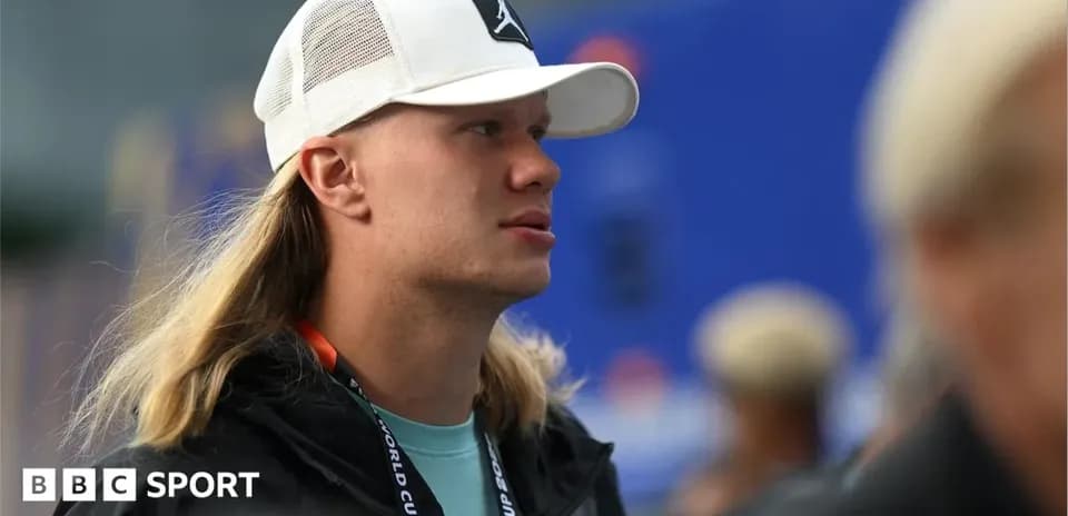 Individual wearing a white cap at an event