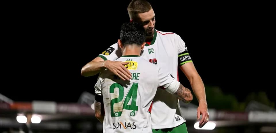 Players embracing after a match on the field