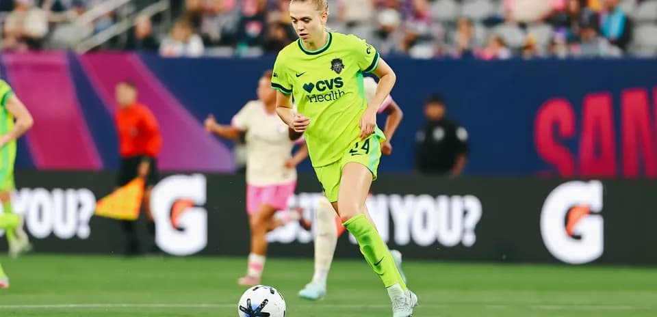 Player dribbling the ball during NWSL match