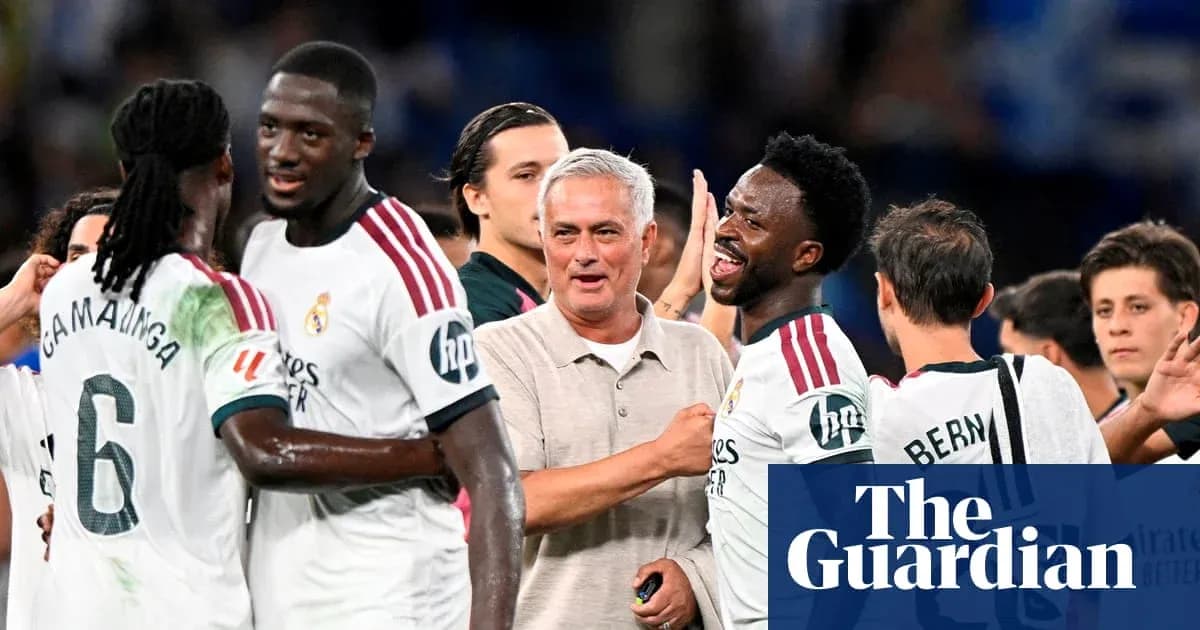 Players celebrating with coach after match victory