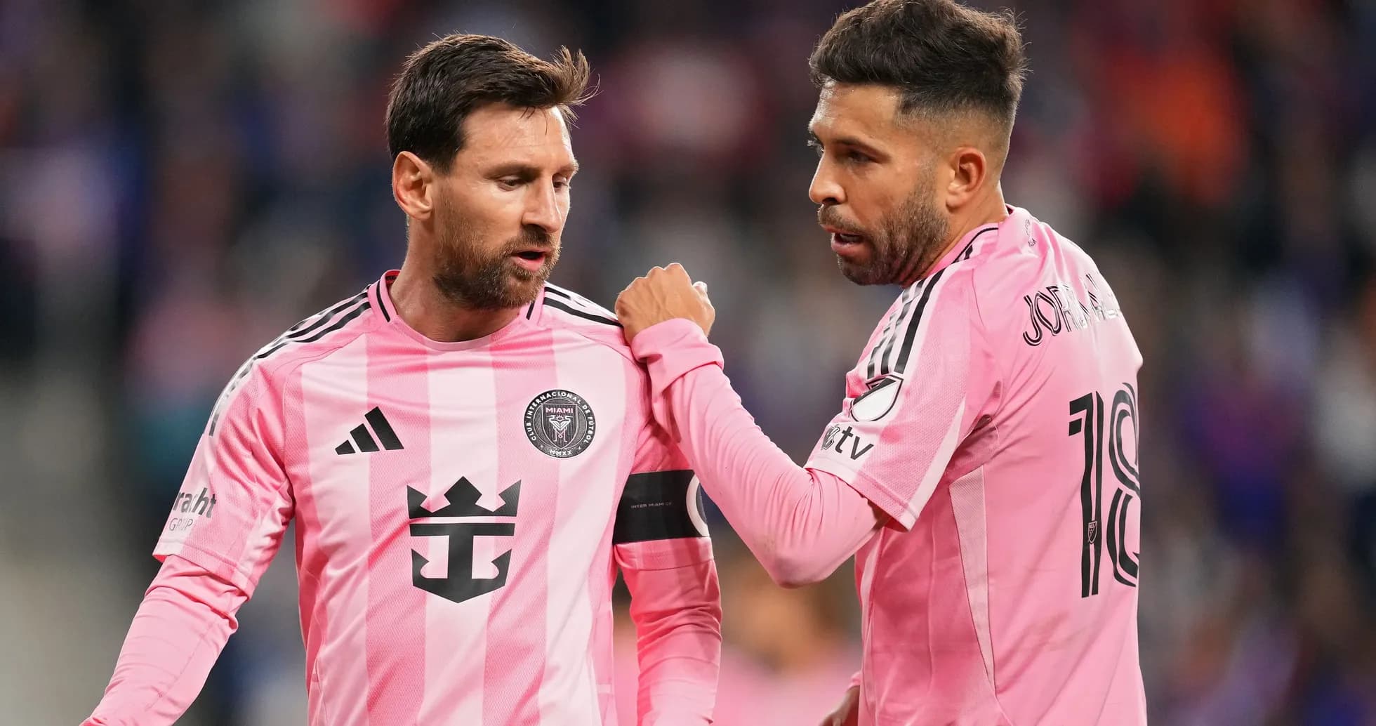 Two players discussing on the field during match