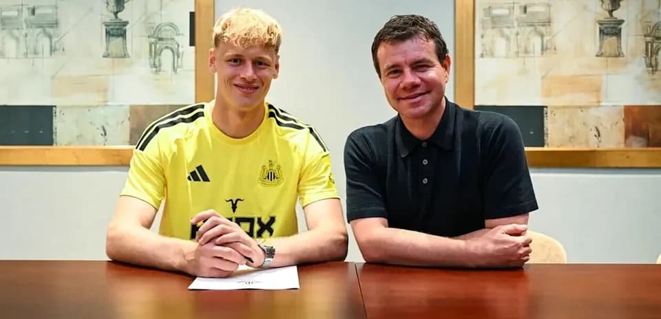 Player signing contract with club representative indoors