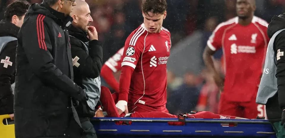 Player being assisted off field on stretcher