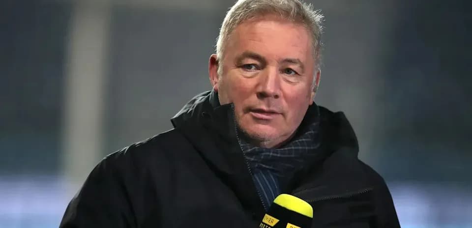 Sports commentator speaking into microphone on set