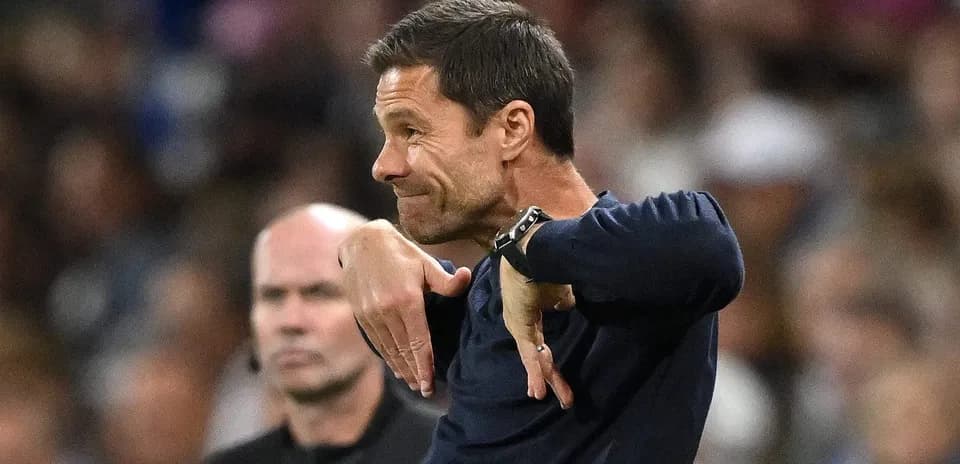 Coach gesturing on the sidelines during match