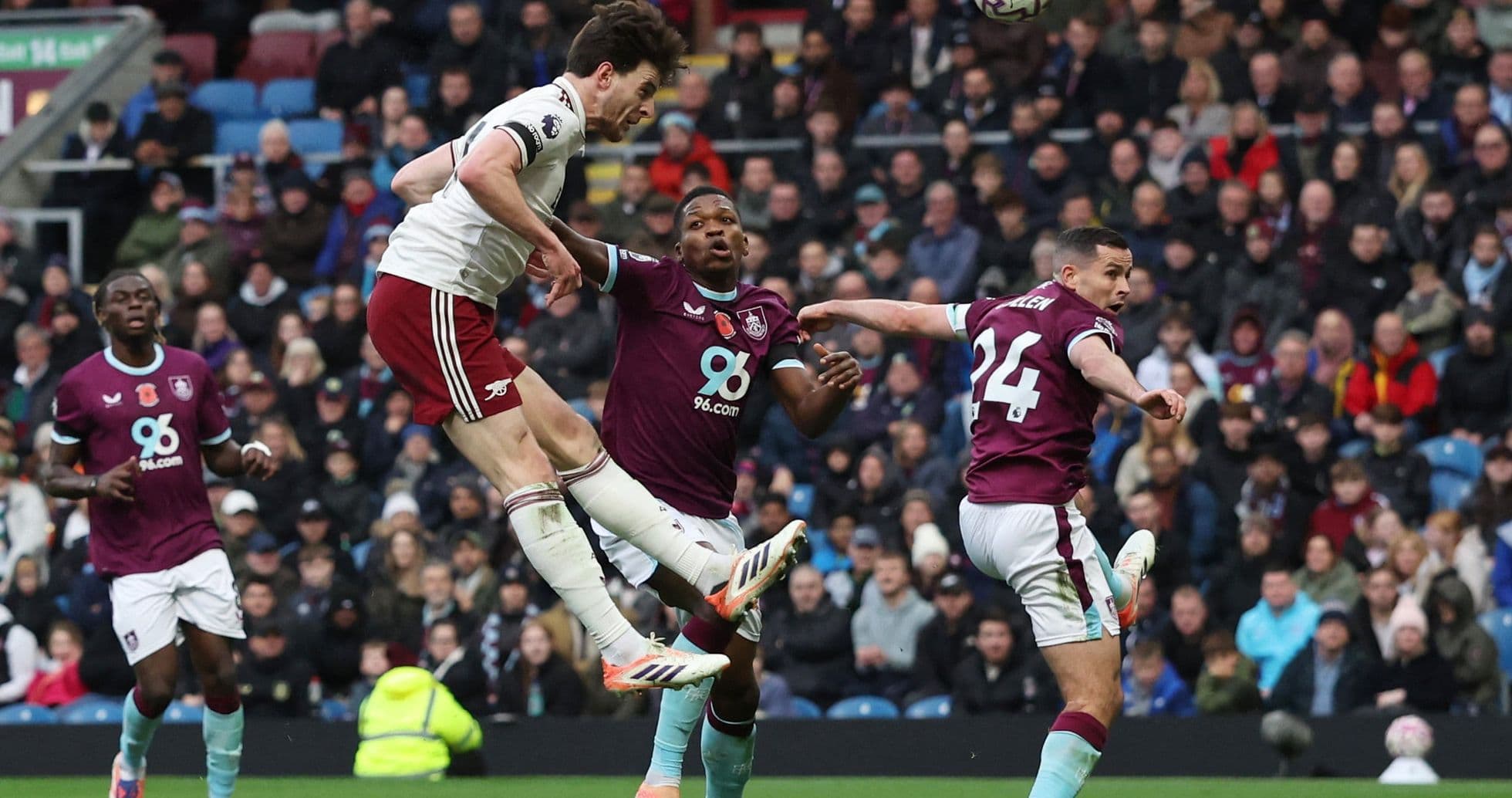 Arsenal player heads the ball against Burnley