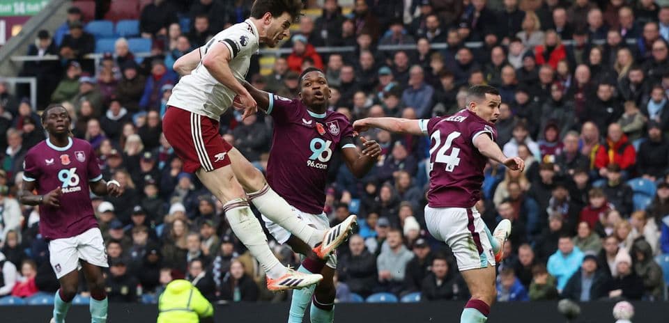 Arsenal player heads the ball against Burnley