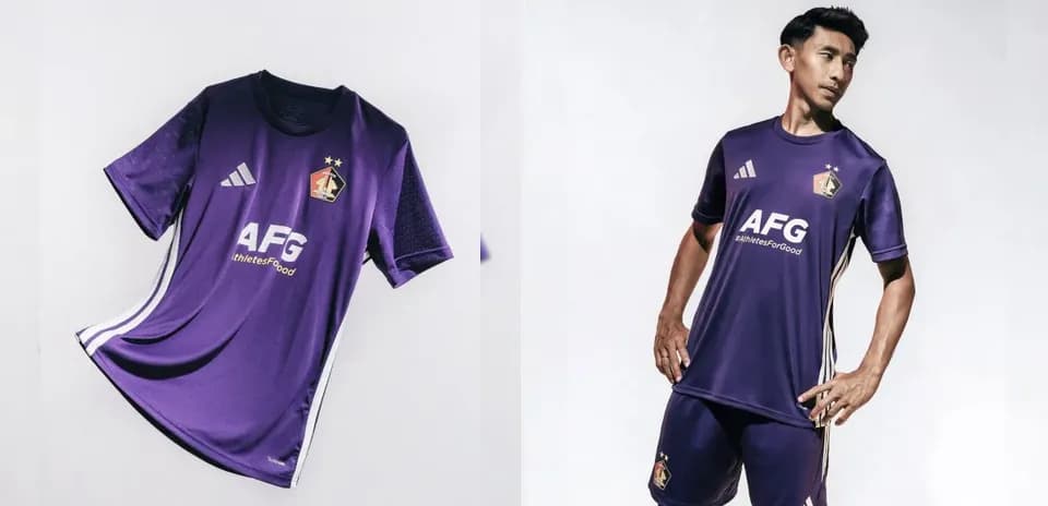 Purple soccer jersey displayed with player wearing it