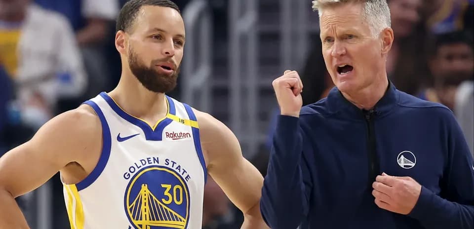 Stephen Curry and coach discussing during game