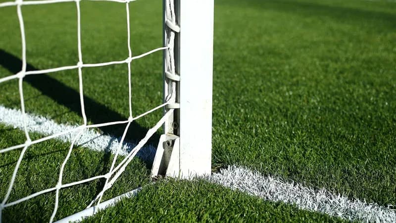Close-up of soccer goalpost and netting