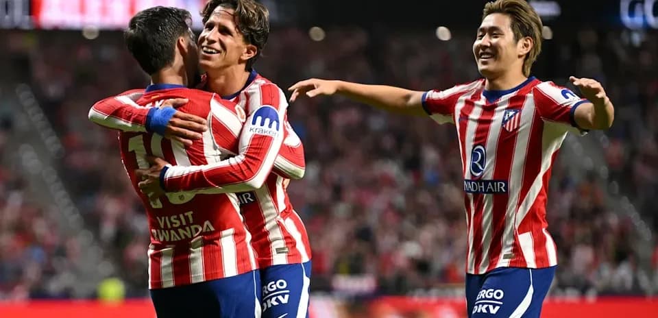 Atletico Madrid players celebrating a goal together