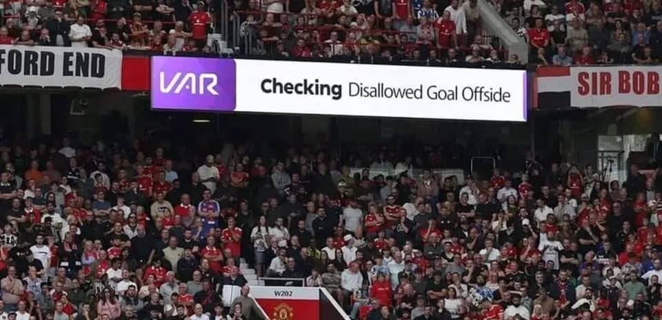 Crowd watching VAR announcement for disallowed goal