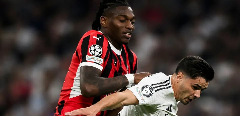 Two players battling for possession during match