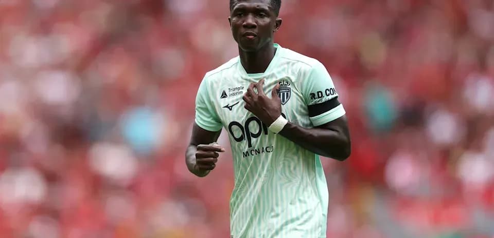 Player in mint green jersey during match