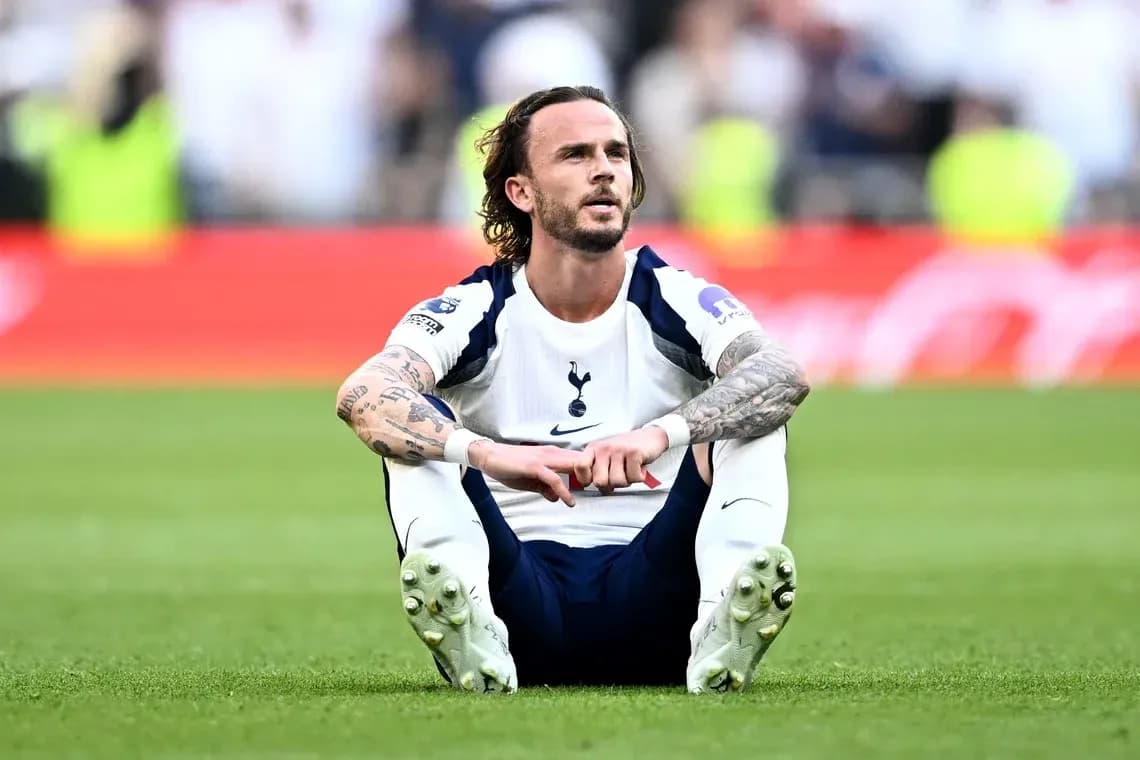 Player sitting on the pitch after a match