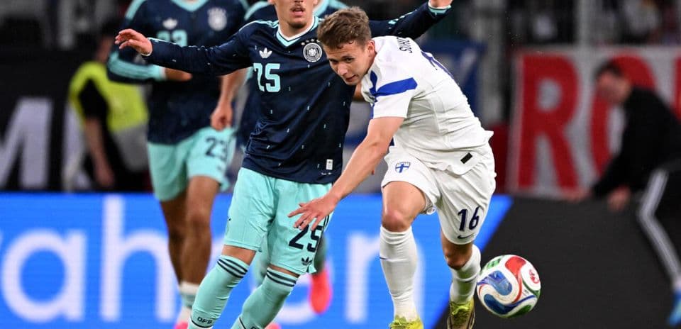 Players battling for possession during a football match