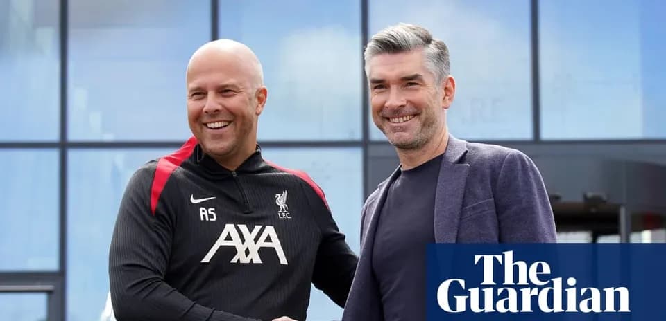 Two men shaking hands outside a Liverpool facility