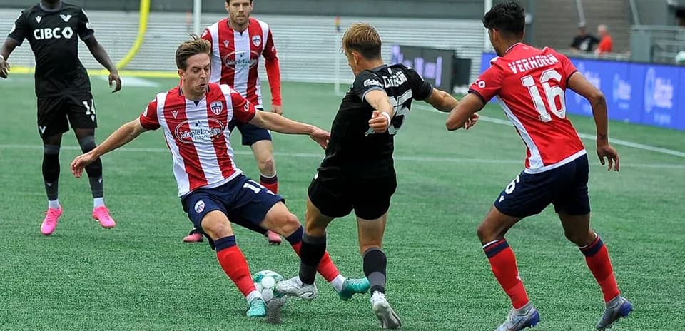 Players battling for the ball during match