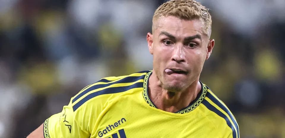 Player in yellow jersey running during a match