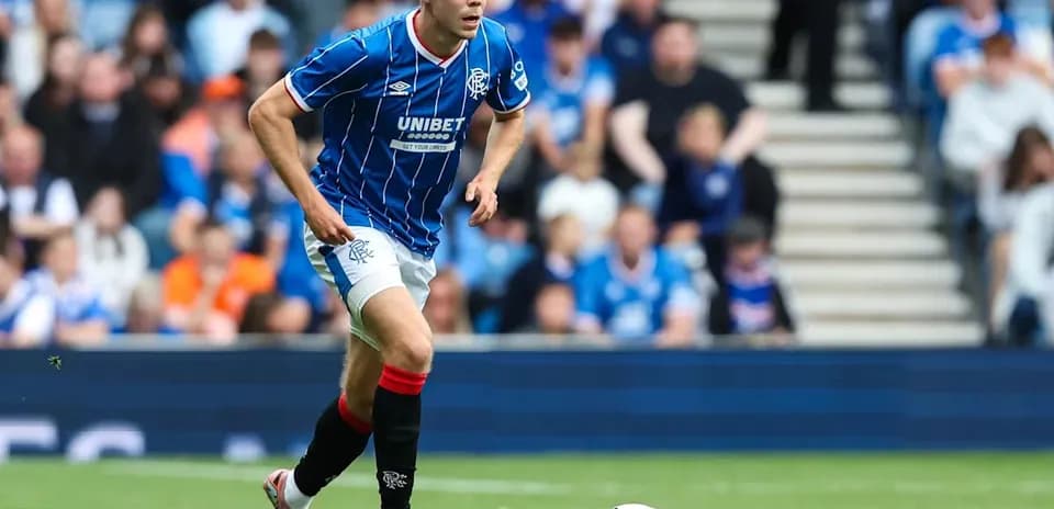 Player running with ball during football match