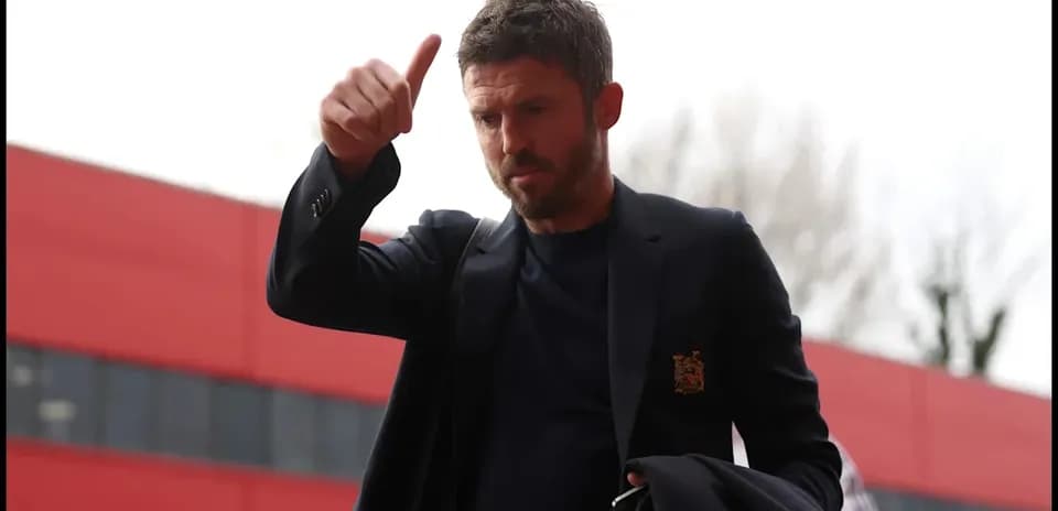 Man giving a thumbs up outside stadium