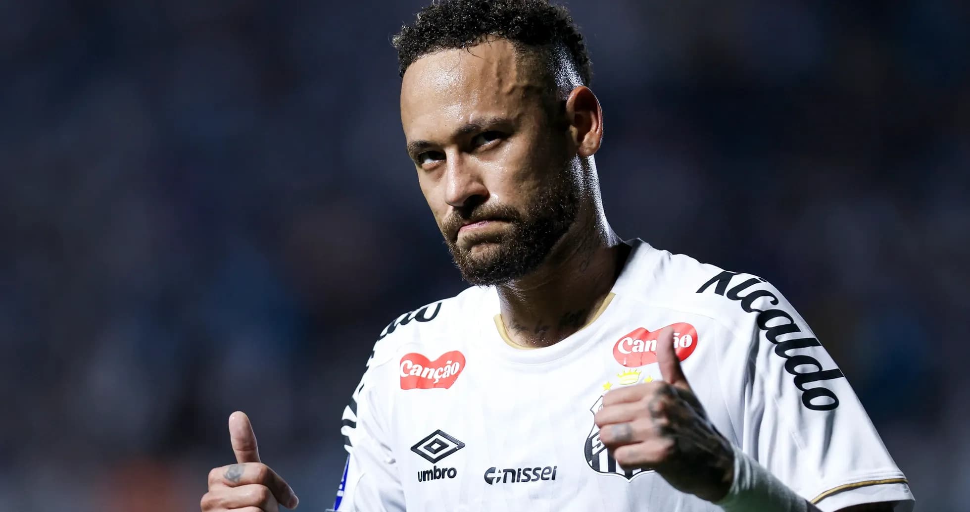Player giving thumbs up during match celebration