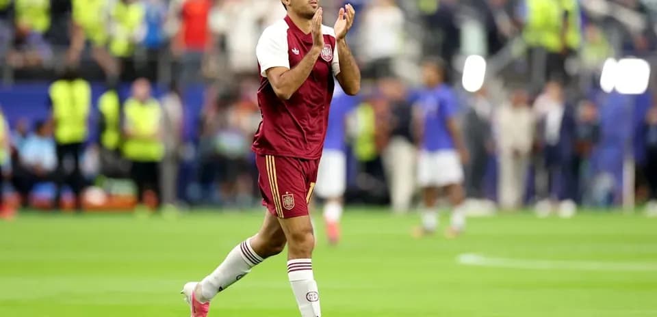 Player applauding fans after a match