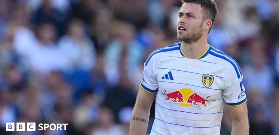 Leeds United player during match with fans in background