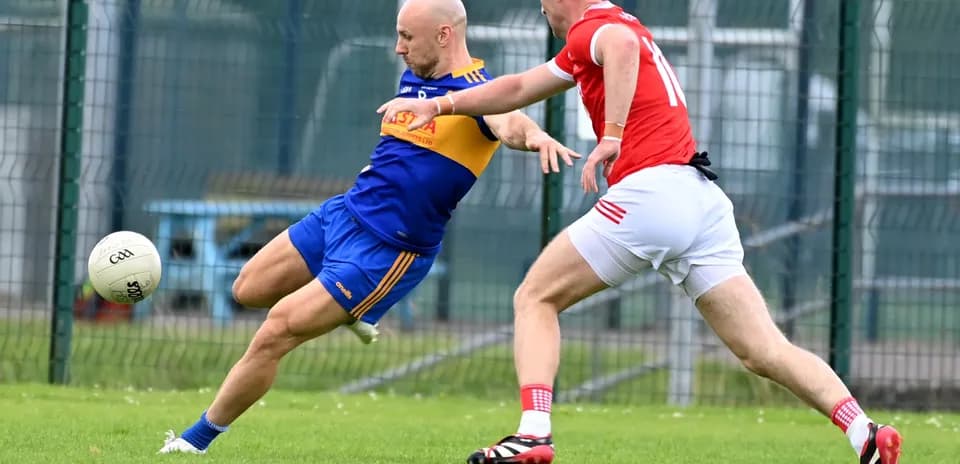 Two players competing for the ball on the field