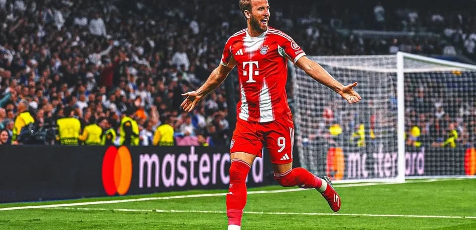 Player celebrating goal during match with fans in background